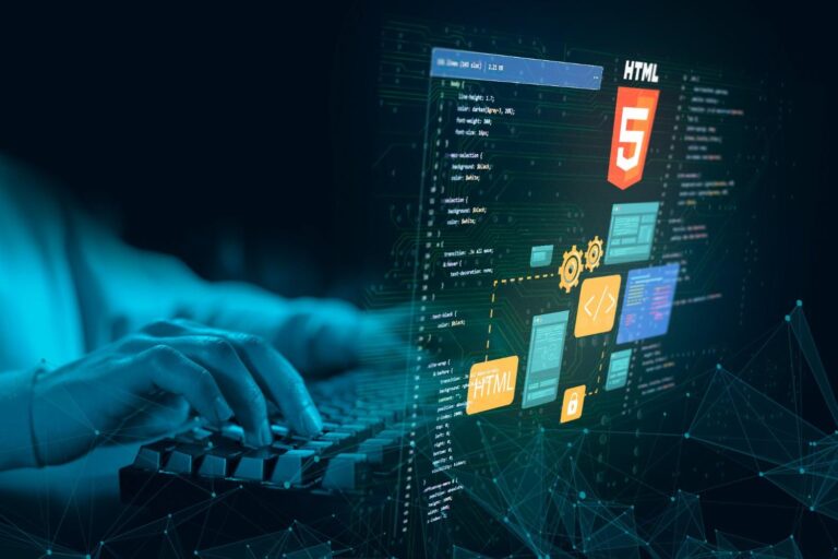 Web developer coding a responsive website on dual monitors with HTML and CSS